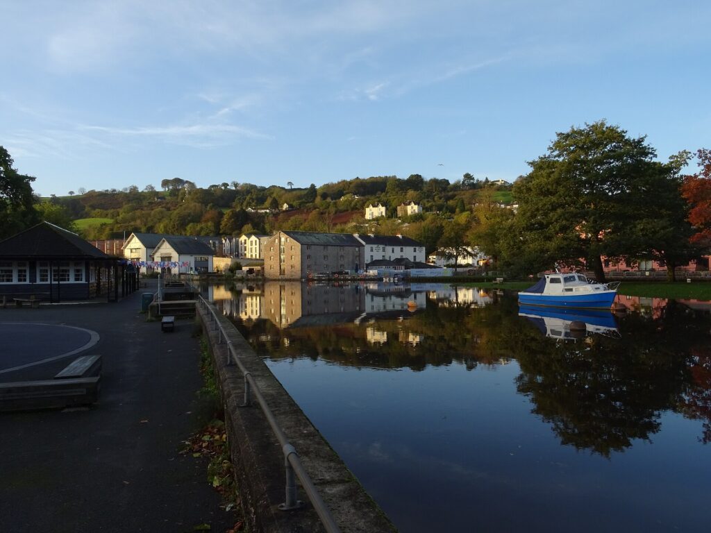 Kingsbridge Hill from Steamer Quay in Totnes looking across the River Dart past the Steam Packet Inn and Totnes Down Hill on a dry autumn morning after a few wet and windy days, with more inclement weather in the forecast.