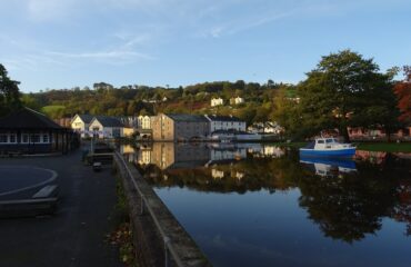 Kingsbridge Hill from Steamer Quay in Totnes looking across the River Dart past the Steam Packet Inn and Totnes Down Hill on a dry autumn morning after a few wet and windy days, with more inclement weather in the forecast.