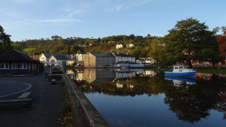 Kingsbridge Hill from Steamer Quay in Totnes looking across the River Dart past the Steam Packet Inn and Totnes Down Hill on a dry autumn morning after a few wet and windy days, with more inclement weather in the forecast.