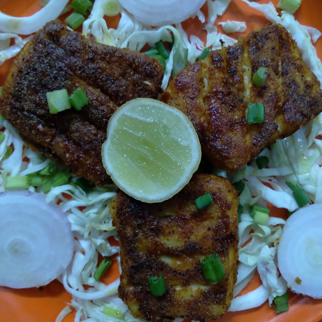 A juicy and spicy fish wrapped up in some Indian spices and semolina and fried with a little touch of cooking oil.