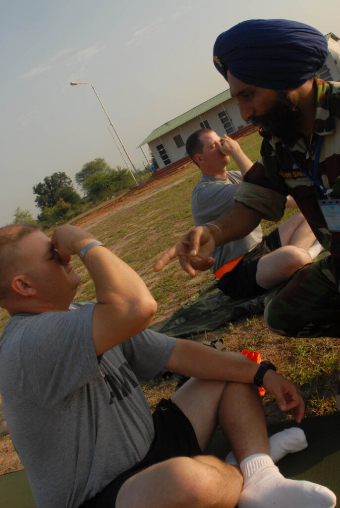Sgt. 1st Class William Dressel, platoon sergeant, Troop B, 2nd Squadron, 14th Cavalry Regiment, "Strykehorse," 2nd Stryker Brigade Combat Team, 25th Infantry Division, takes breathing advice from Indian Army Naib Subedar Jasbir Singh during a yoga session at Camp Bundela in Babina, India, Oct. 11. The instruction is part of a cultural exchange between the Indian Army and the U.S. Army. The Soldiers are in India in support of Exercise Yudh Abhyas 09. YA09, which is scheduled for Oct. 12-27, is a bilateral exercise involving the Armies of India and the United States. The primary goal of the exercise is to develop and expand upon the relationship between the Indian and U.S. See more at www.army.mil