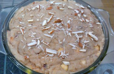This dish in the image is an instant and easily cooked bread halwa make out of bread and milk with toppings of grated cashew and almond.