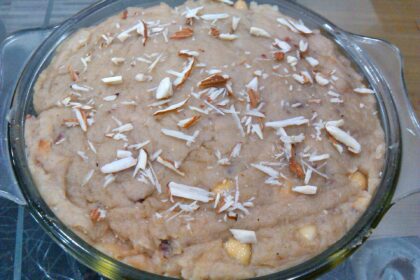 This dish in the image is an instant and easily cooked bread halwa make out of bread and milk with toppings of grated cashew and almond.