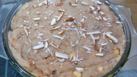 This dish in the image is an instant and easily cooked bread halwa make out of bread and milk with toppings of grated cashew and almond.