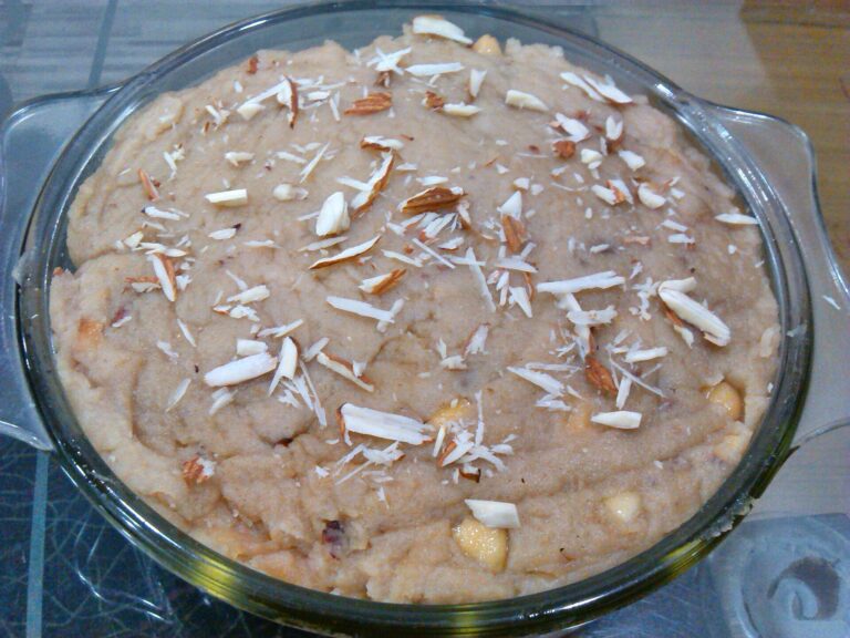 This dish in the image is an instant and easily cooked bread halwa make out of bread and milk with toppings of grated cashew and almond.